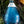 Freeland Spirits blue bottle Gin nestled in botanicals. Distilled in Portland, Oregon. 