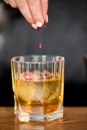 Rose Old Fashioned crafted by Freeland Spirits, garnished with rose petals