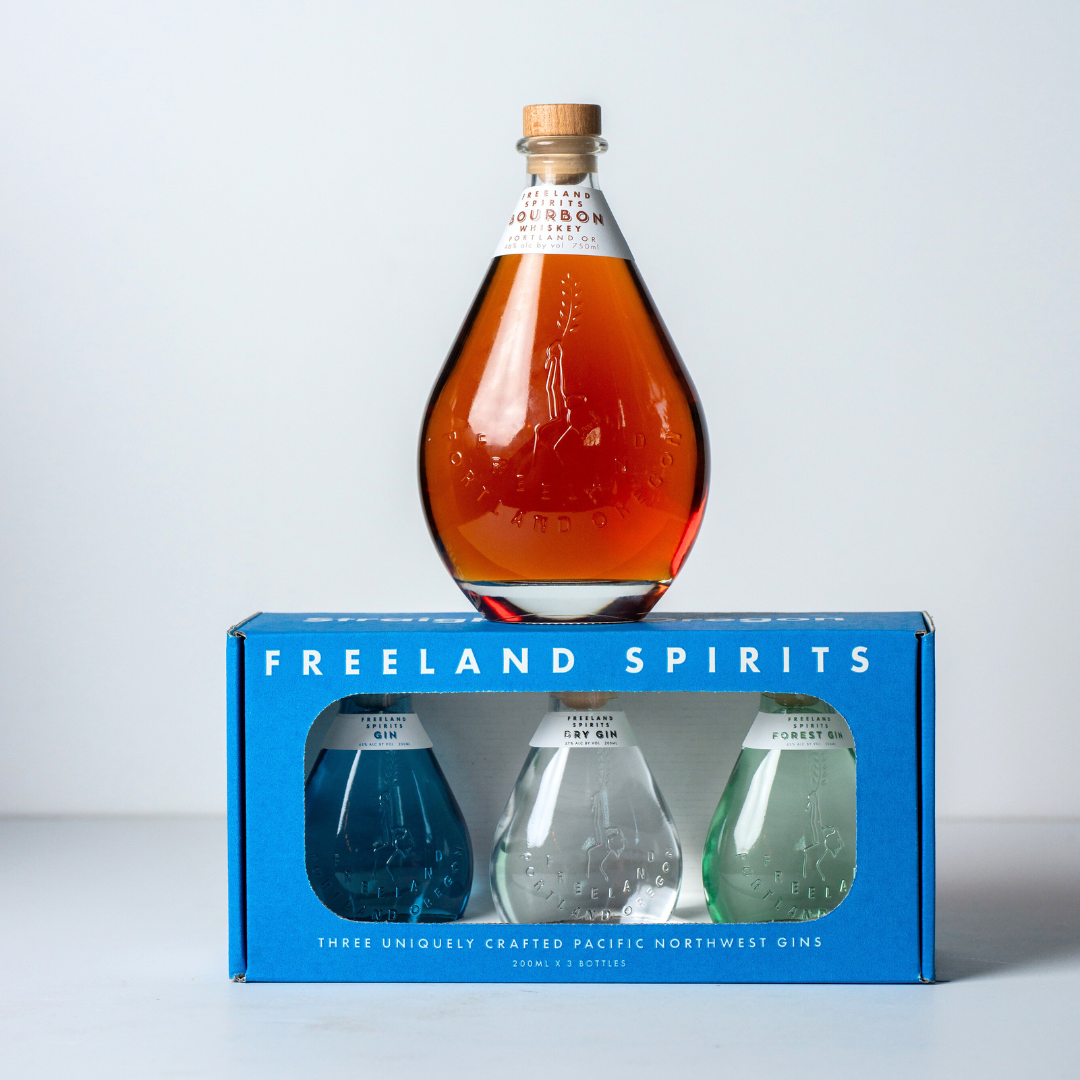 Freeland Bourbon bottle bundled with a Gin sampler gift pack including Freeland Gin, Dry Gin Navy Strength, and Forest Gin