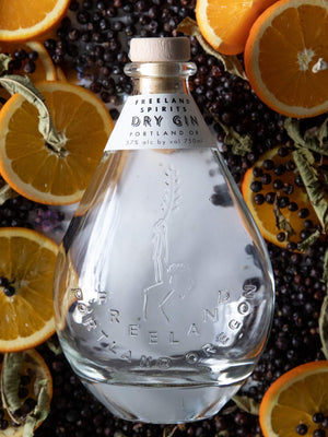 Freeland Spirits Navy-strength Dry Gin. Orange citrus. Distilled in Portland, Oregon. 