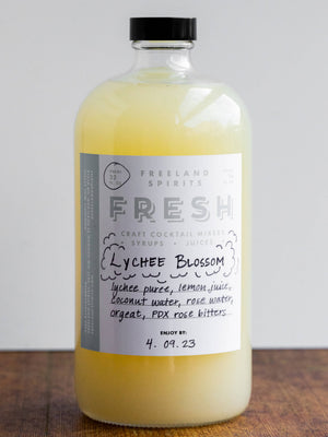 32 oz bottle of Lychee Blossom Fresh Spring Cocktail Mixer by Freeland Spirits. 
