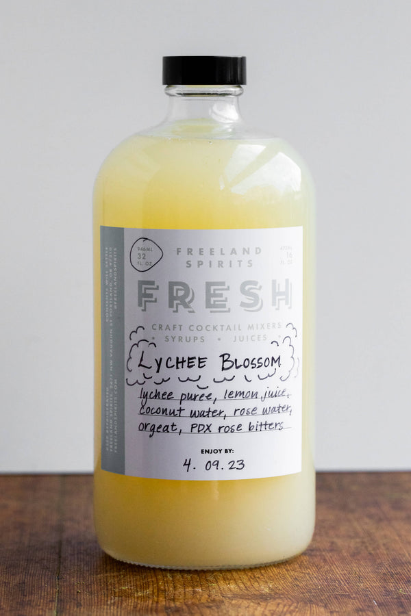 32 oz bottle of Lychee Blossom Fresh Spring Cocktail Mixer by Freeland Spirits. 